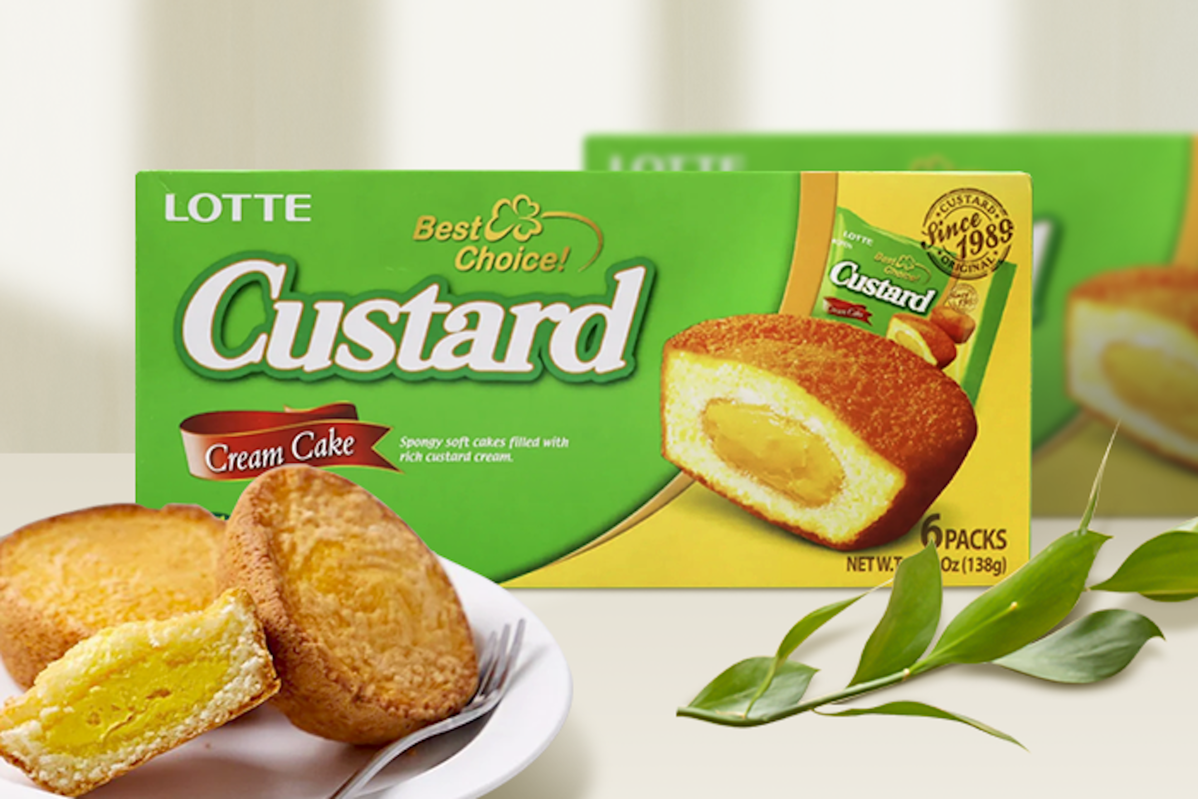 A close-up of a Lotte Custard Cream Cake split open to reveal the custard filling.